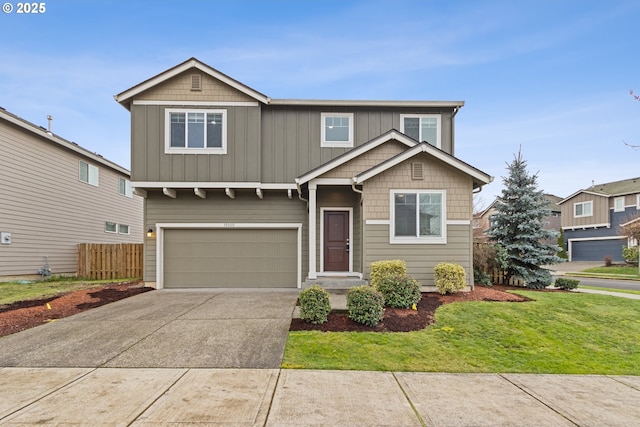 view of front of house featuring a garage and a front yard