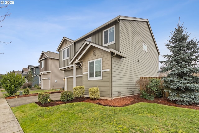 view of front of house with a front lawn and a garage