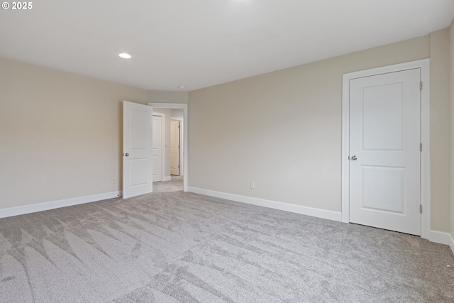 empty room featuring light carpet