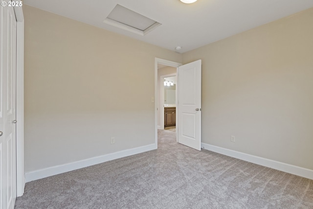 unfurnished room with light carpet