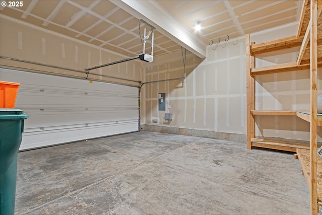 garage with electric panel and a garage door opener