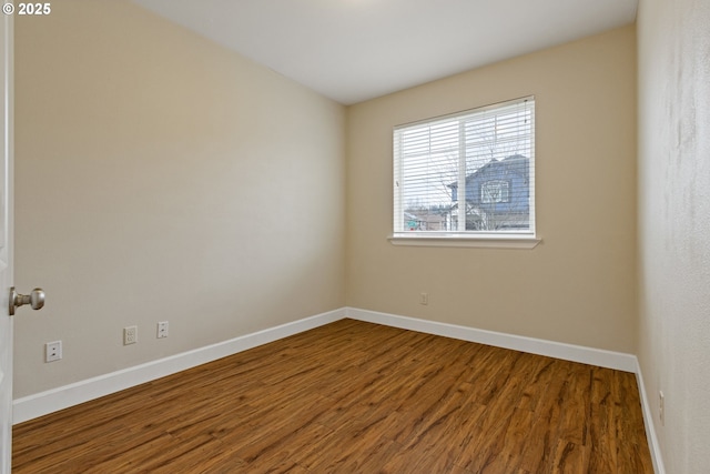 empty room featuring wood-type flooring