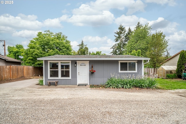2115 NE 86th Ave, Vancouver, WA 98664 - view of front of house with fence, a greenhouse, and an outdoor structure