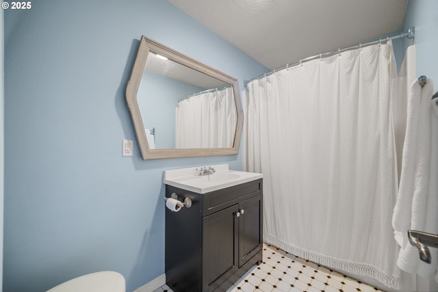 2115 NE 86th Ave, Vancouver, WA 98664 - bathroom with vanity, tile patterned floors, toilet, and baseboards