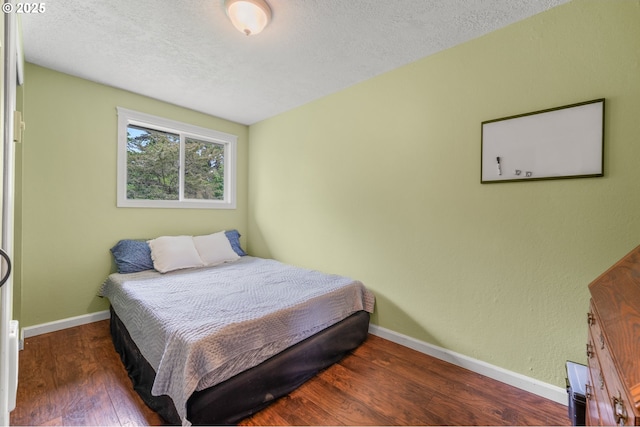2115 NE 86th Ave, Vancouver, WA 98664 - bedroom featuring wood finished floors, baseboards, and a textured ceiling