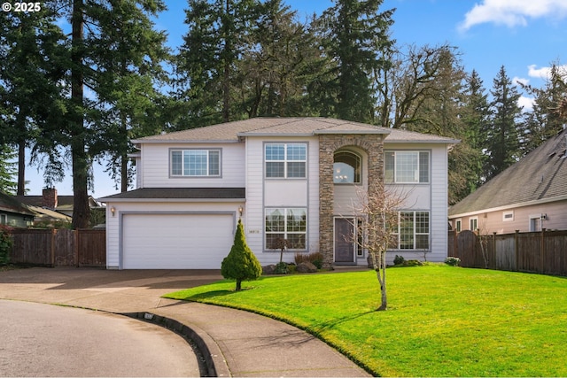 traditional-style home with stone siding, fence, concrete driveway, and a front yard