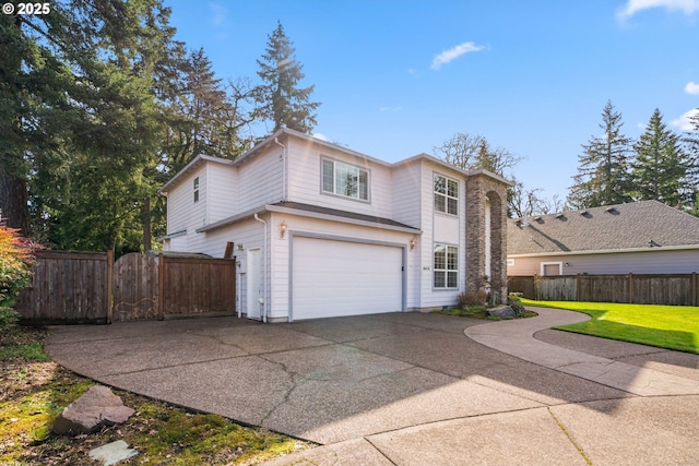 view of front of home featuring concrete driveway, fence, a front lawn, and an attached garage