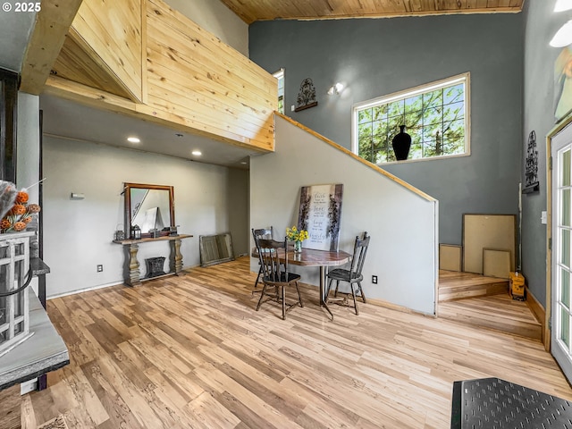 dining area with wood ceiling, wood finished floors, stairway, high vaulted ceiling, and recessed lighting