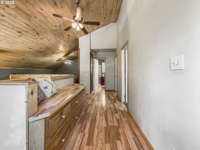 corridor with wood ceiling, lofted ceiling, and light wood finished floors