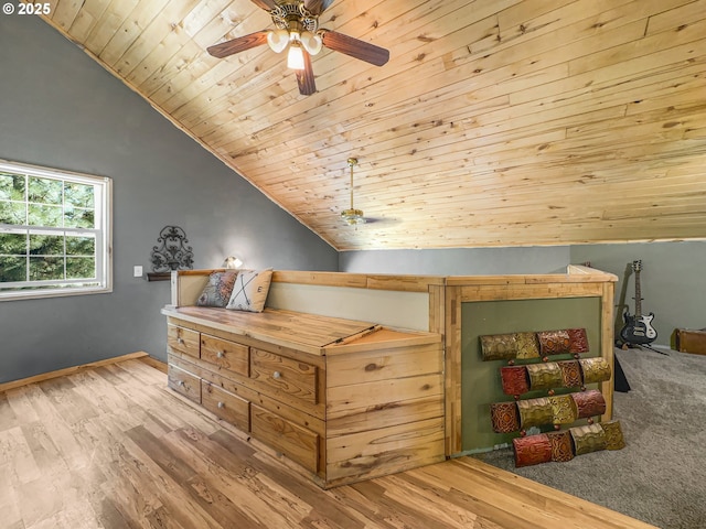 bedroom with lofted ceiling, wooden ceiling, wood finished floors, baseboards, and a ceiling fan