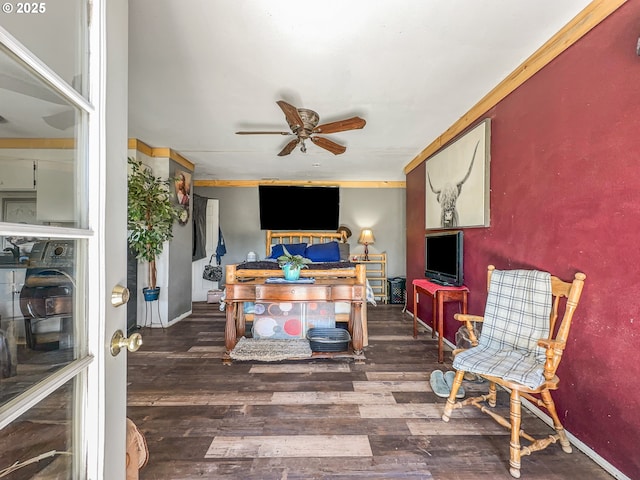 living area featuring ceiling fan, wood finished floors, and baseboards