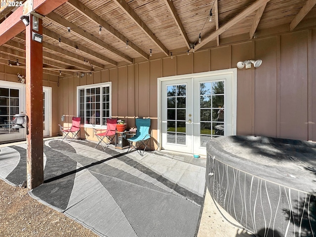 view of patio / terrace featuring french doors and a hot tub