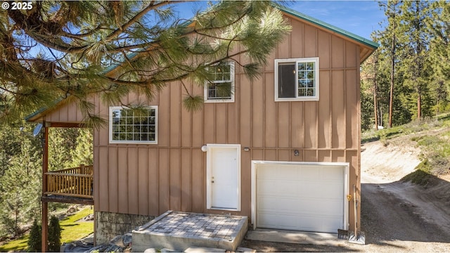 view of front of house with an attached garage and board and batten siding
