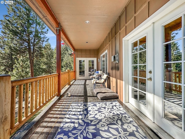 wooden deck featuring french doors