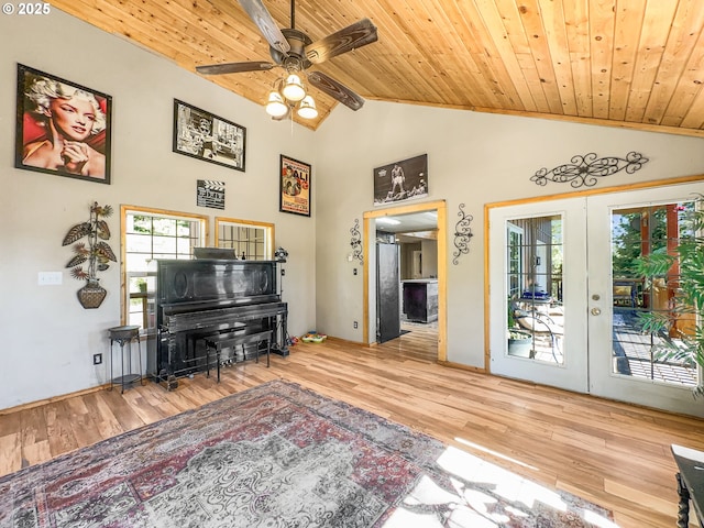 living area featuring wooden ceiling, a ceiling fan, french doors, wood finished floors, and high vaulted ceiling