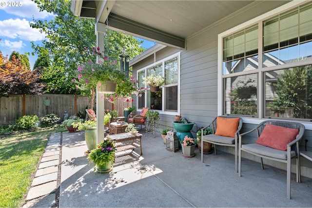 view of patio featuring fence