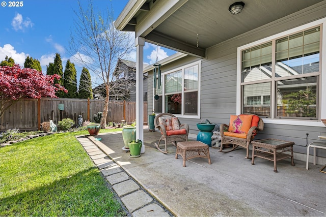 view of patio with fence and an outdoor living space