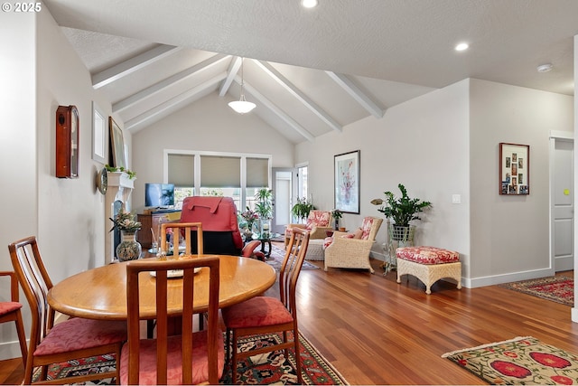 dining space featuring vaulted ceiling with beams, baseboards, recessed lighting, and wood finished floors