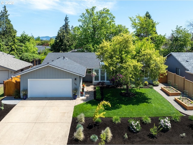 view of front of property with a garden, driveway, a shingled roof, and a garage