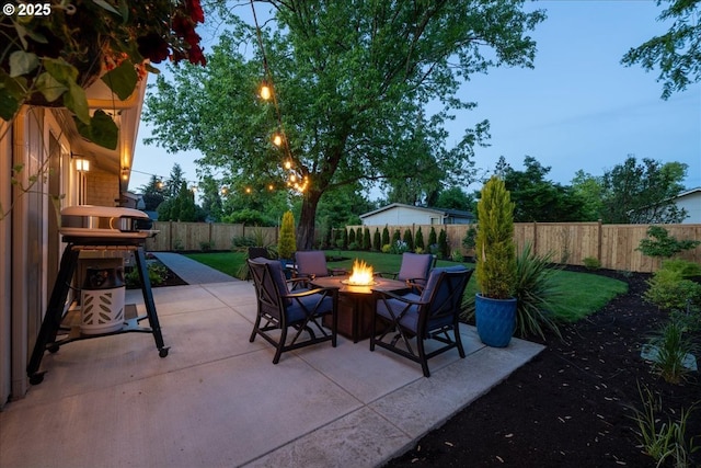 view of patio / terrace with a fire pit and a fenced backyard