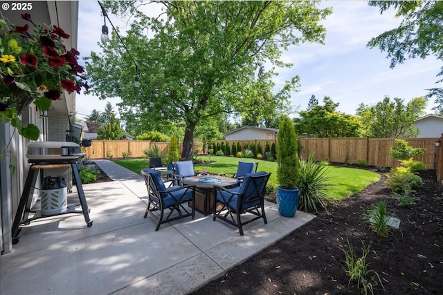 view of patio with a fire pit and area for grilling