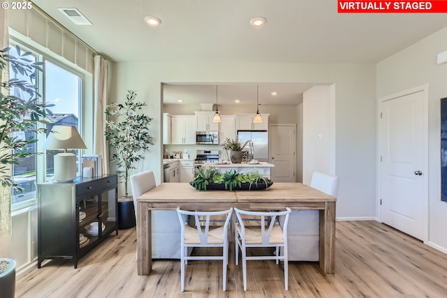 11325 NW Main St, North Plains, OR 97133 - dining room featuring light wood-type flooring, recessed lighting, and baseboards