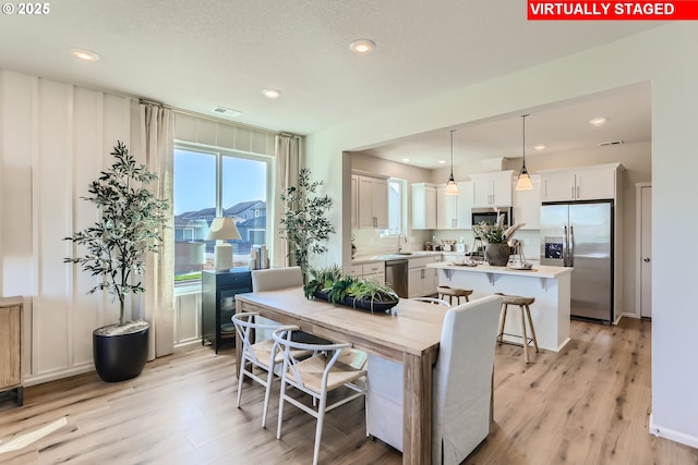11325 NW Main St, North Plains, OR 97133 - dining room with light wood-style flooring and recessed lighting