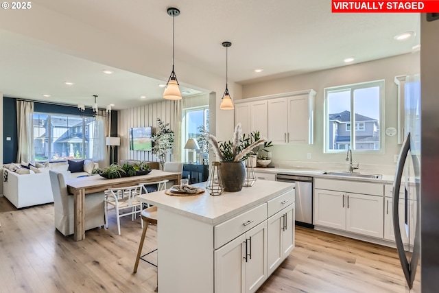 11325 NW Main St, North Plains, OR 97133 - kitchen featuring a sink, stainless steel appliances, healthy amount of natural light, white cabinets, and recessed lighting