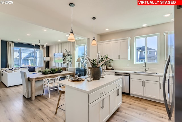 11325 NW Main St, North Plains, OR 97133 - kitchen with a sink, appliances with stainless steel finishes, plenty of natural light, light wood finished floors, and recessed lighting
