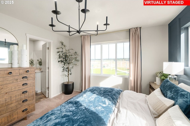 11325 NW Main St, North Plains, OR 97133 - bedroom featuring a chandelier, light colored carpet, and baseboards