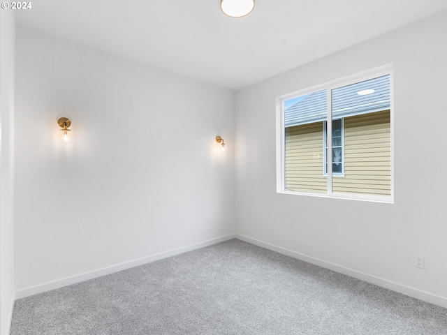 unfurnished room with carpet flooring