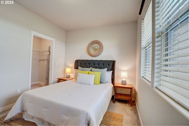 16417 NW Chadwick Way Unit 302, Portland, OR 97229 - bedroom featuring carpet floors and a walk in closet