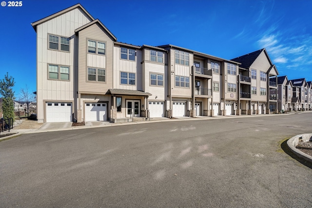 16417 NW Chadwick Way Unit 302, Portland, OR 97229 - view of property with a garage and a residential view