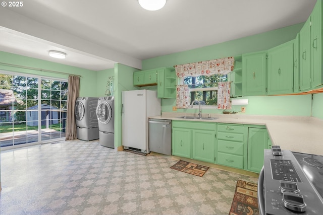 13307 SE Raymond St, Portland, OR 97236 - kitchen with washer and clothes dryer, appliances with stainless steel finishes, a sink, open shelves, and light floors