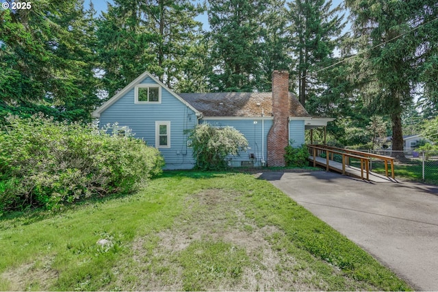 13307 SE Raymond St, Portland, OR 97236 - view of front facade with a chimney and driveway