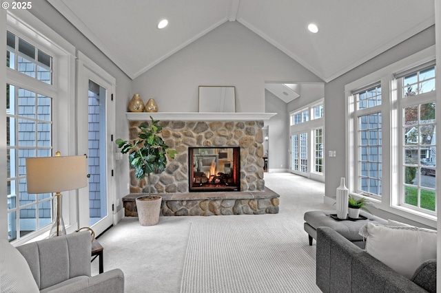 carpeted living area with recessed lighting, a fireplace, baseboards, and high vaulted ceiling