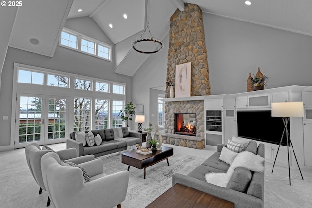 living area with light carpet, a stone fireplace, recessed lighting, and lofted ceiling with beams