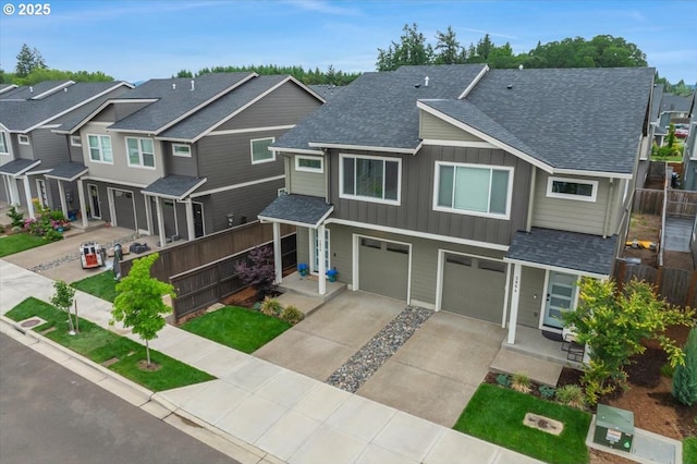 2856 S Nectarine St, Cornelius, OR 97113 - view of property featuring a garage, board and batten siding, a shingled roof, driveway, and a residential view