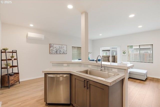 2856 S Nectarine St, Cornelius, OR 97113 - kitchen featuring stainless steel dishwasher, a sink, a wall mounted AC, light wood-type flooring, and recessed lighting