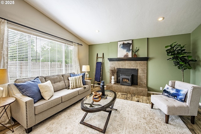 5354 Cody Ave, Eugene, OR 97402 - living area with lofted ceiling, wood finished floors, recessed lighting, and a tiled fireplace
