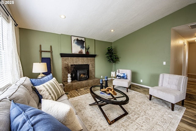 5354 Cody Ave, Eugene, OR 97402 - living area featuring vaulted ceiling, wood finished floors, recessed lighting, and a tile fireplace