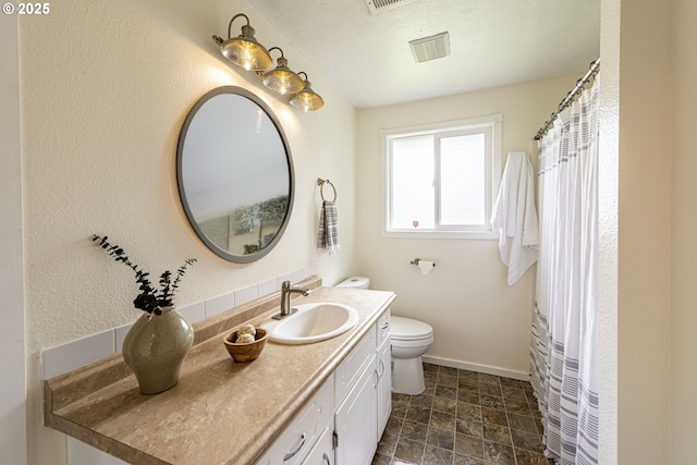 5354 Cody Ave, Eugene, OR 97402 - full bathroom featuring vanity, stone finish floors, and curtained shower