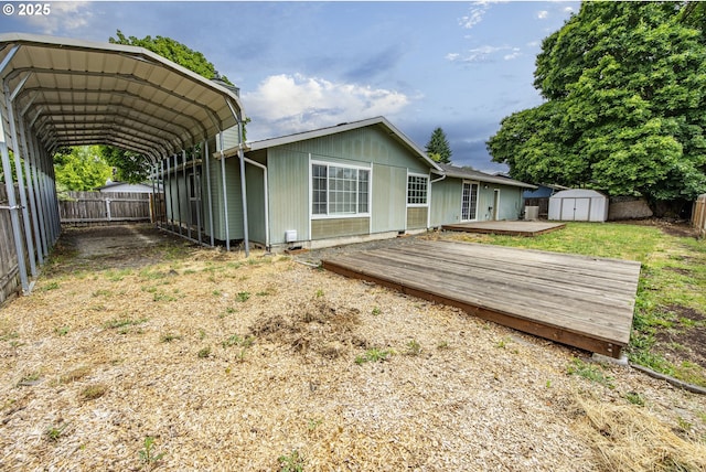 5354 Cody Ave, Eugene, OR 97402 - rear view of house with a storage unit, a deck, and a carport