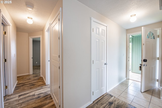5354 Cody Ave, Eugene, OR 97402 - hall with a textured ceiling and light wood-type flooring