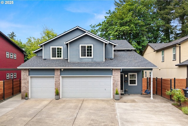 traditional-style house with driveway, fence, and brick siding