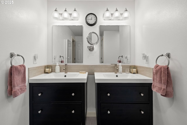full bath with two vanities and tasteful backsplash