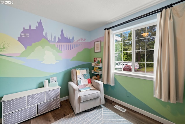 bedroom with baseboards and wood finished floors