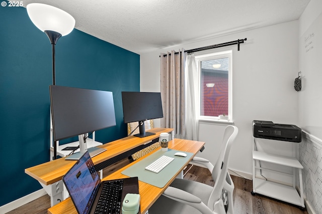 office with wood finished floors and baseboards