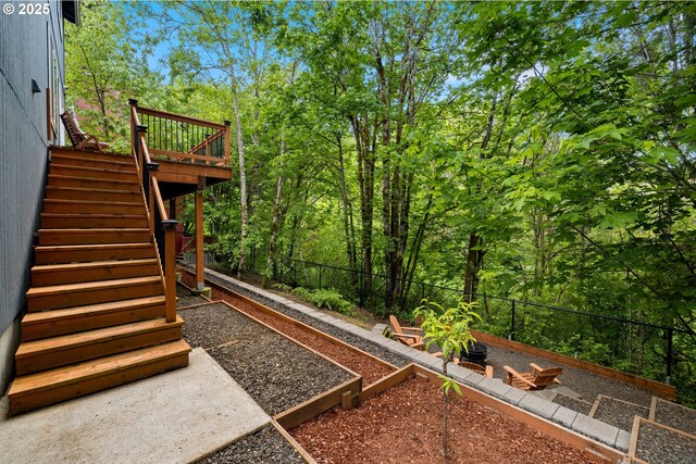 7208 NE Nelly St, Hillsboro, OR 97124 - view of yard featuring a vegetable garden, stairway, and a deck