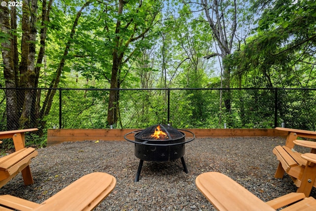 view of yard featuring an outdoor fire pit